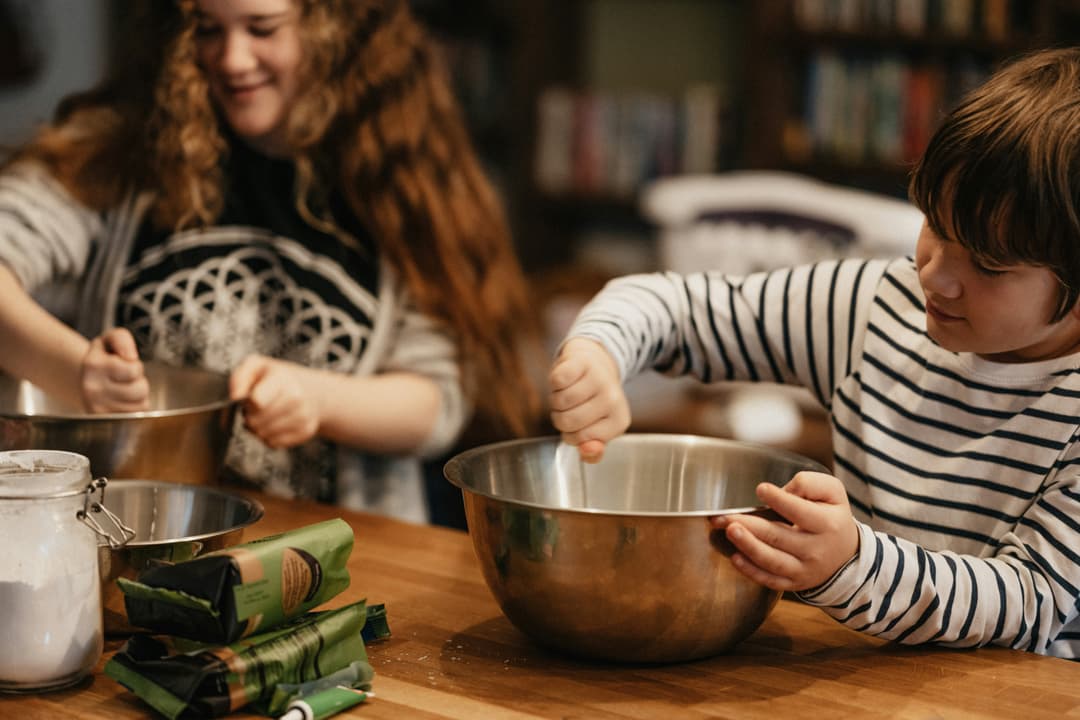 Children cooking together in a kitchen
